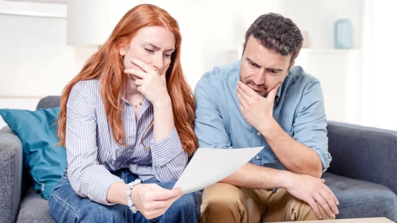 A couple looking at a financial document