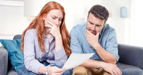 A couple looking at a financial document