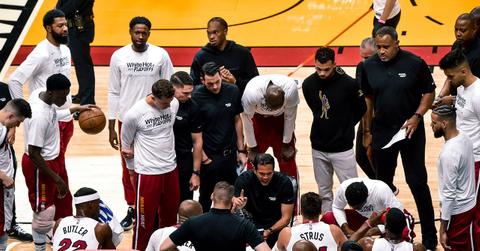 Miami Heat coaching staff and players at a playoff game