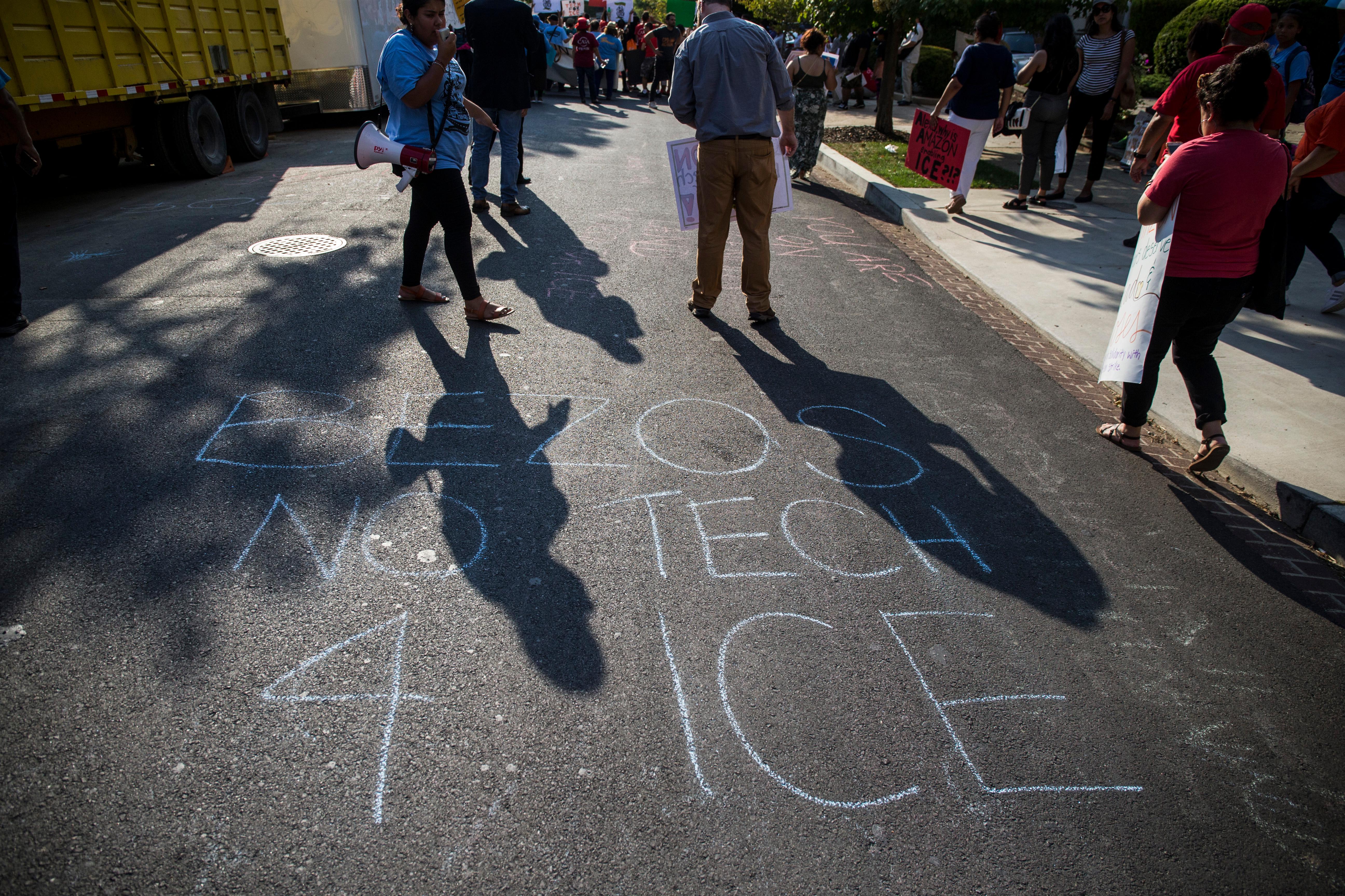 "Bezos No tech 4 ICE" in chalk