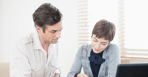 Two people looking over mortgage paperwork