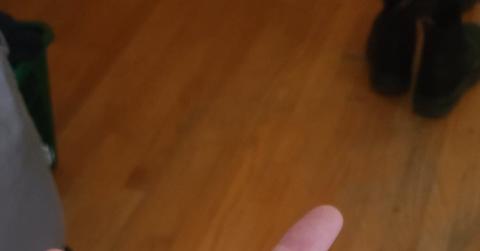 A person holding a Cardano symbol