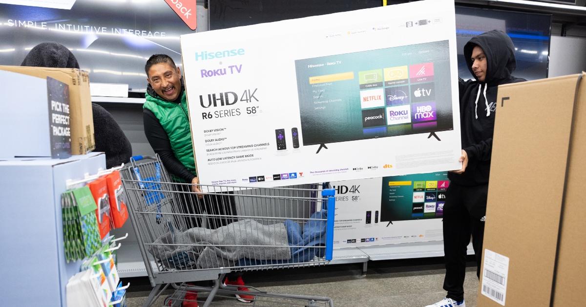 A man shopping for a TV on Black Friday