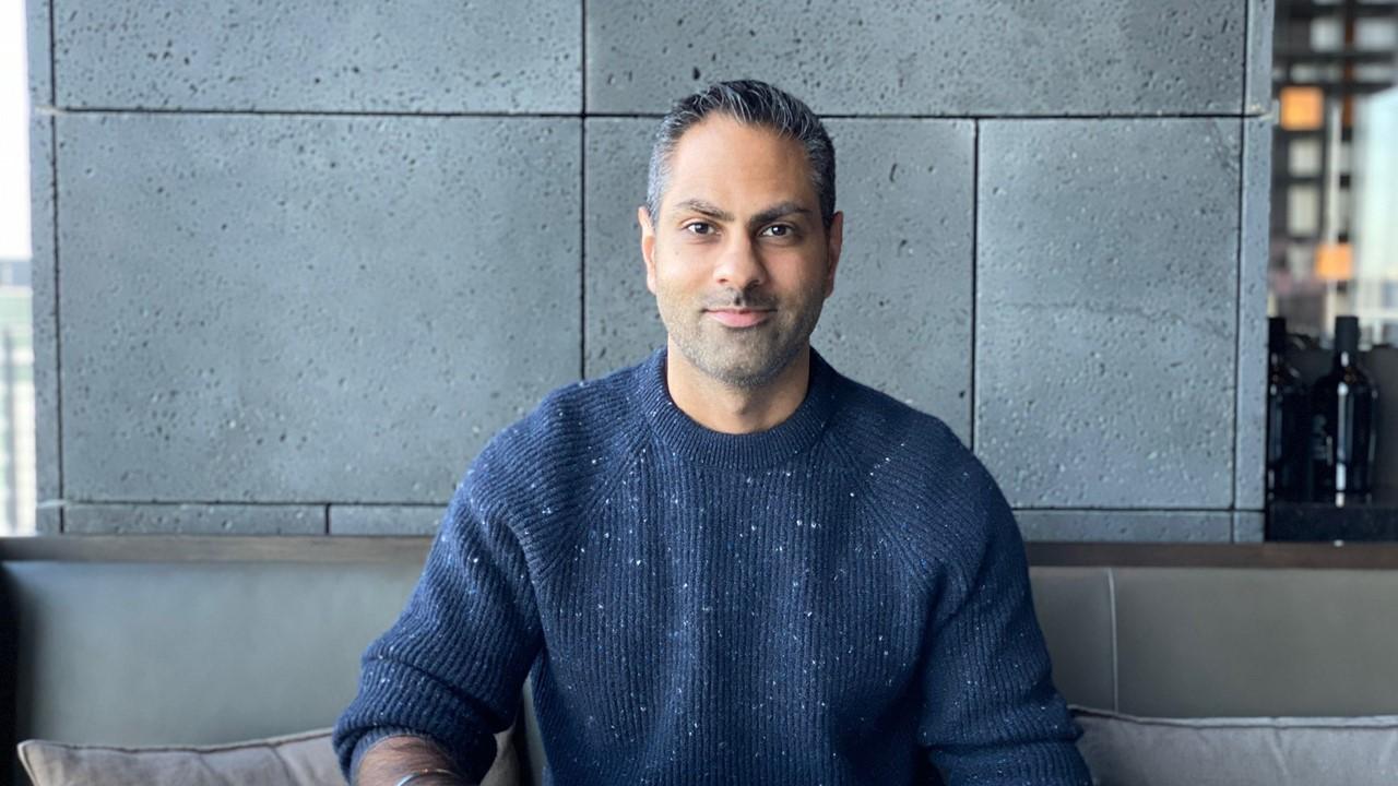 Ramit Sethi wearing a blue sweater