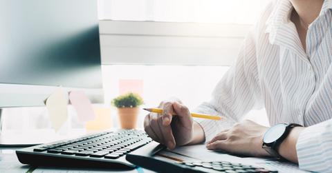 A businessman calculating the ERC tax credit