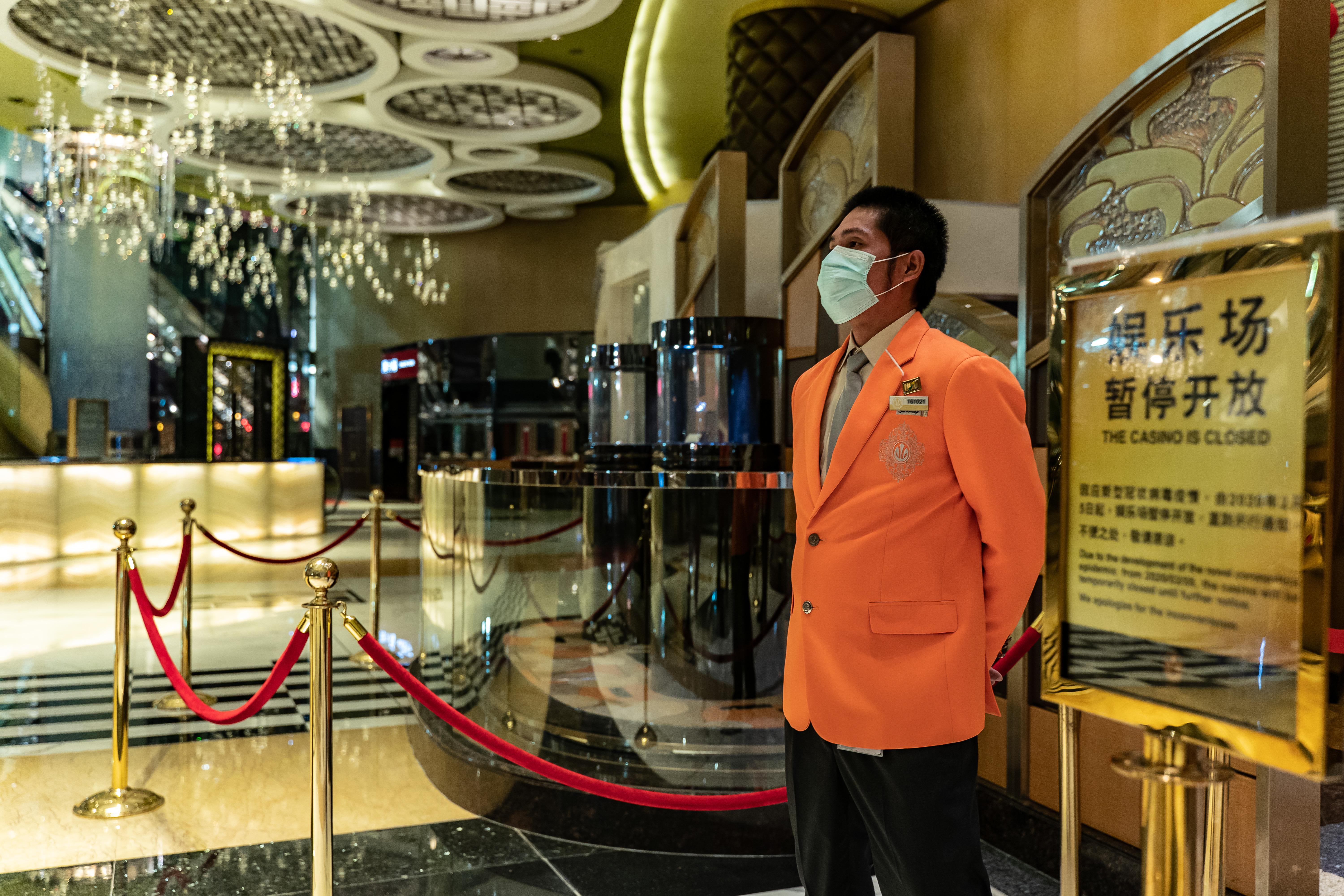 Worker wearing mask inside Macau gambling resort