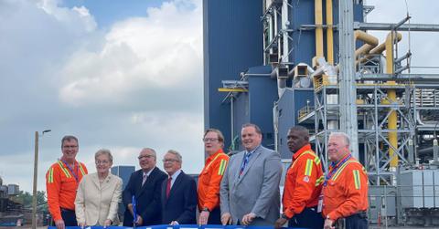 Cleveland-Cliffs employees holding a company banner