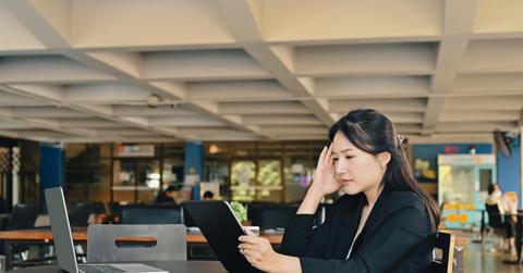 Stressed businesswoman sitting in office
