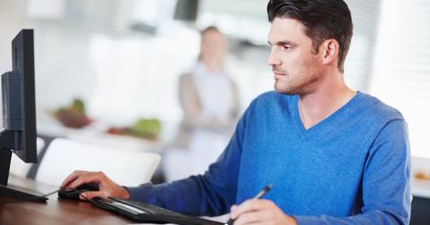 A man doing his taxes online