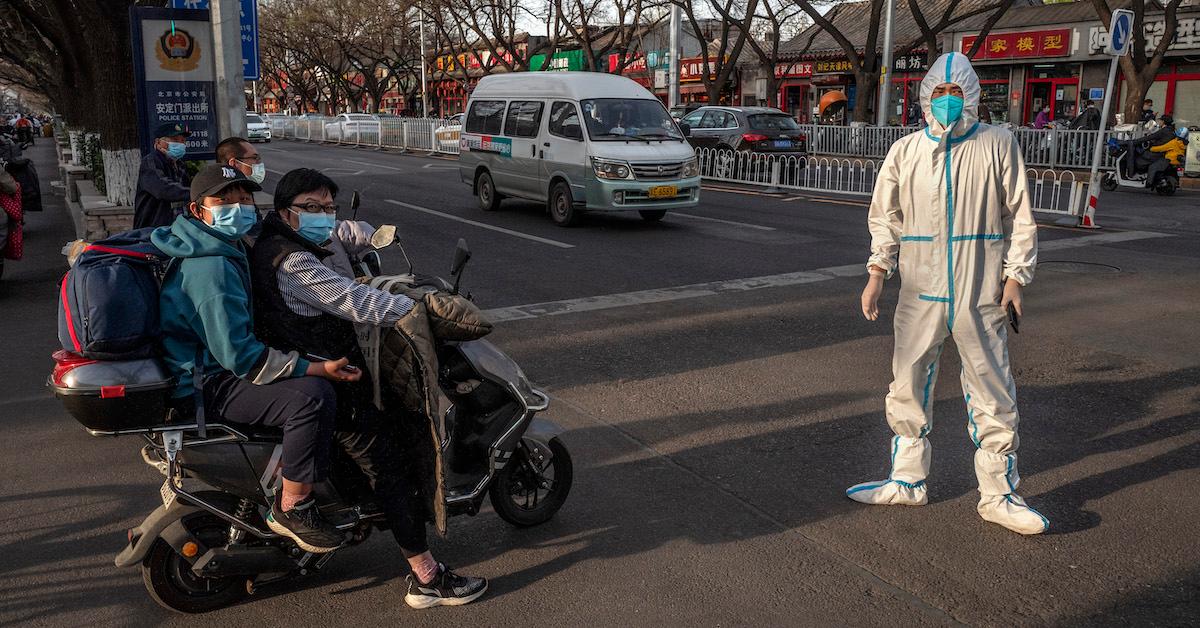 A person in PPE amid China's lockdown measures