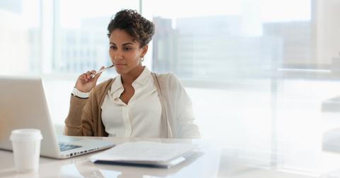 A woman looking at a 401(k) statement