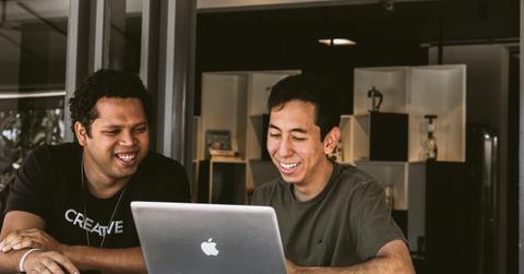 Men reviewing retirement plan options on a laptop