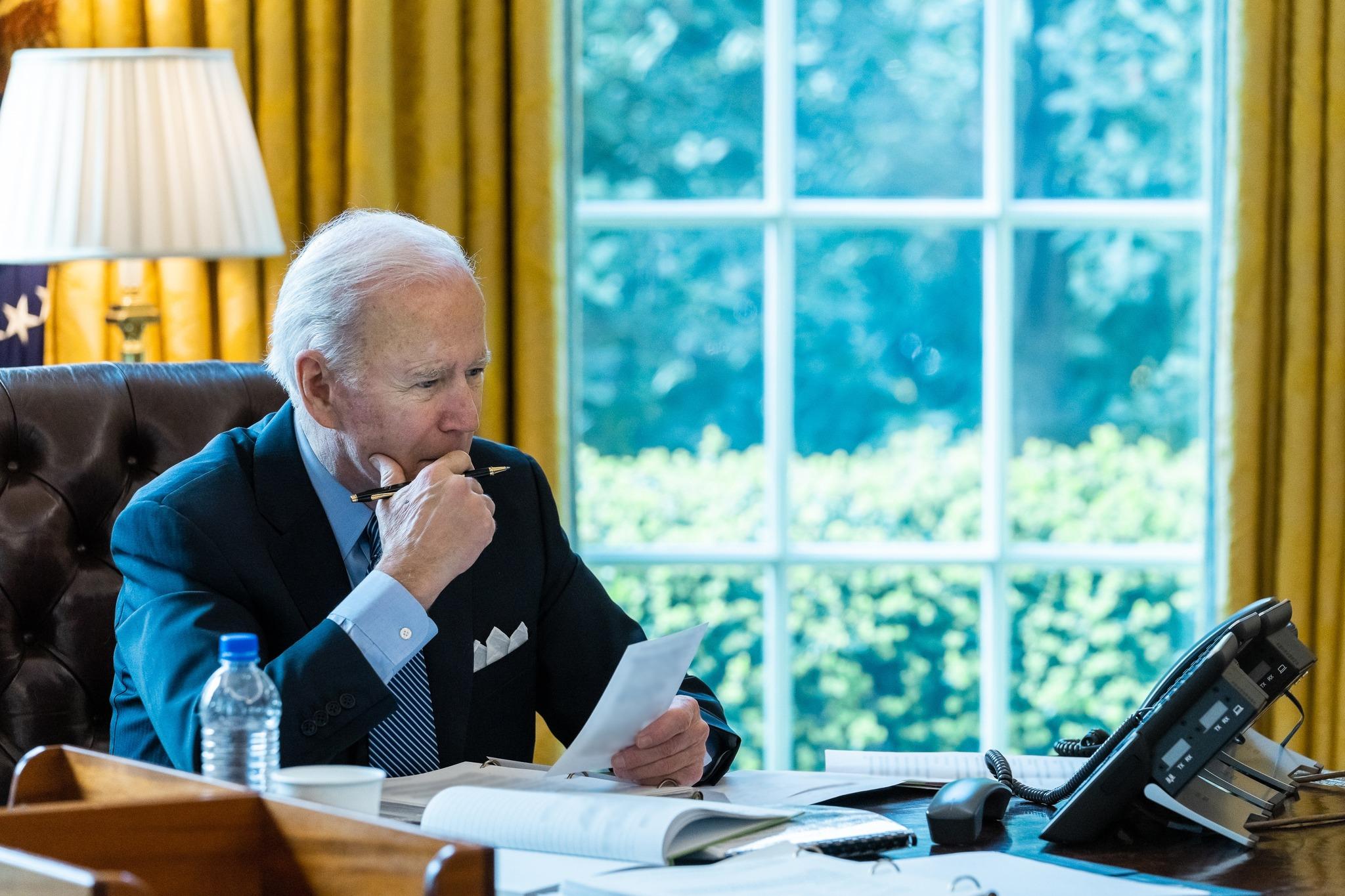 Joe Biden sitting in the White House