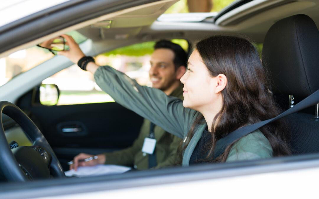 A student and instructor in a driving school car