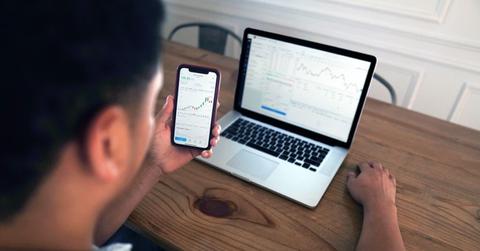 Man looking at GBXI data on a laptop