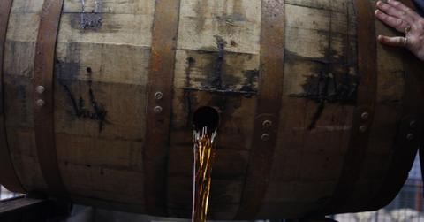 Bourbon pouring from a barrel