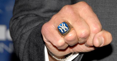 Joe Torre displays his 1996 World Series ring