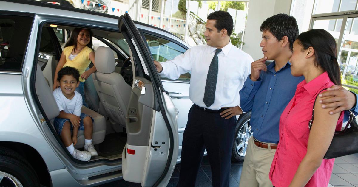 Family at car dealership