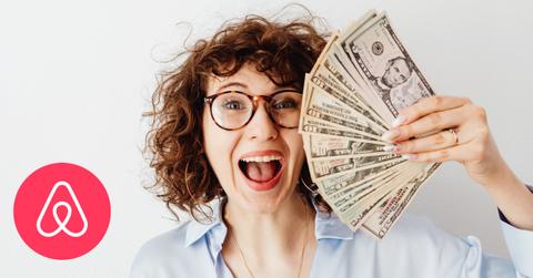 Happy woman holding money