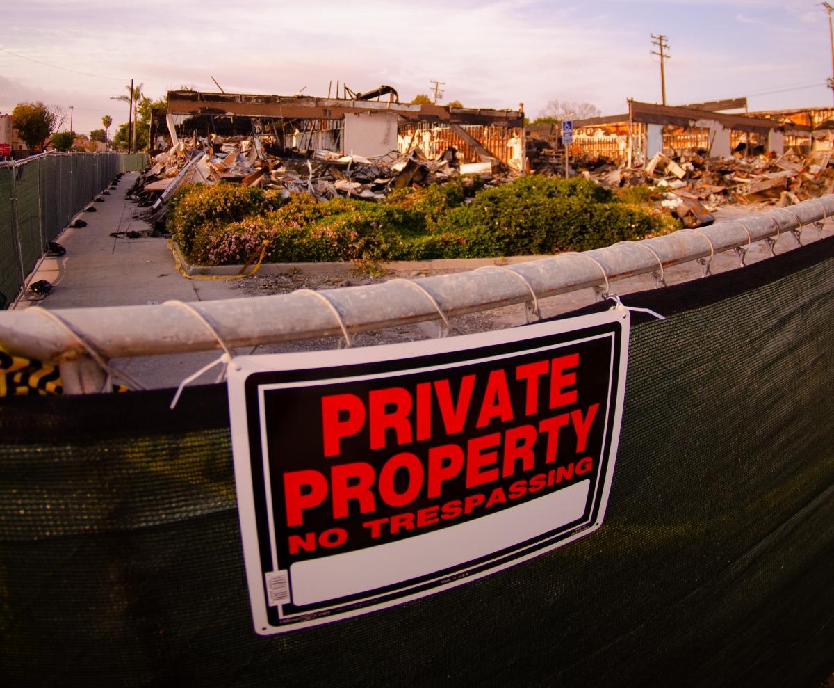 A private property and no trespassing sign on a fence