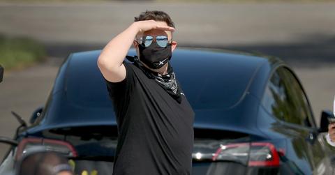 Elon Musk wearing glasses and mask