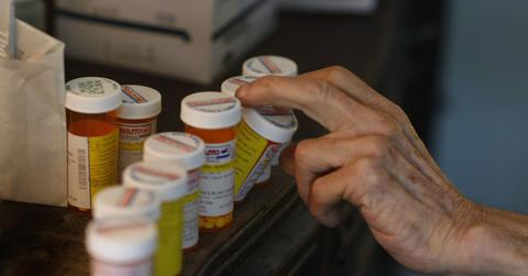 A man reaching for his prescription drugs