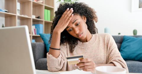 A woman looking at her credit card debt