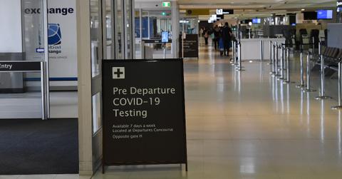 Pre Departure COVID-19 Testing sign at an airport
