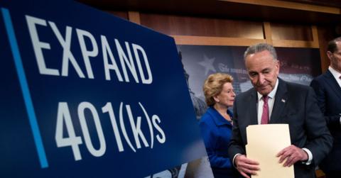 A board displaying "Expand 401(k)s"