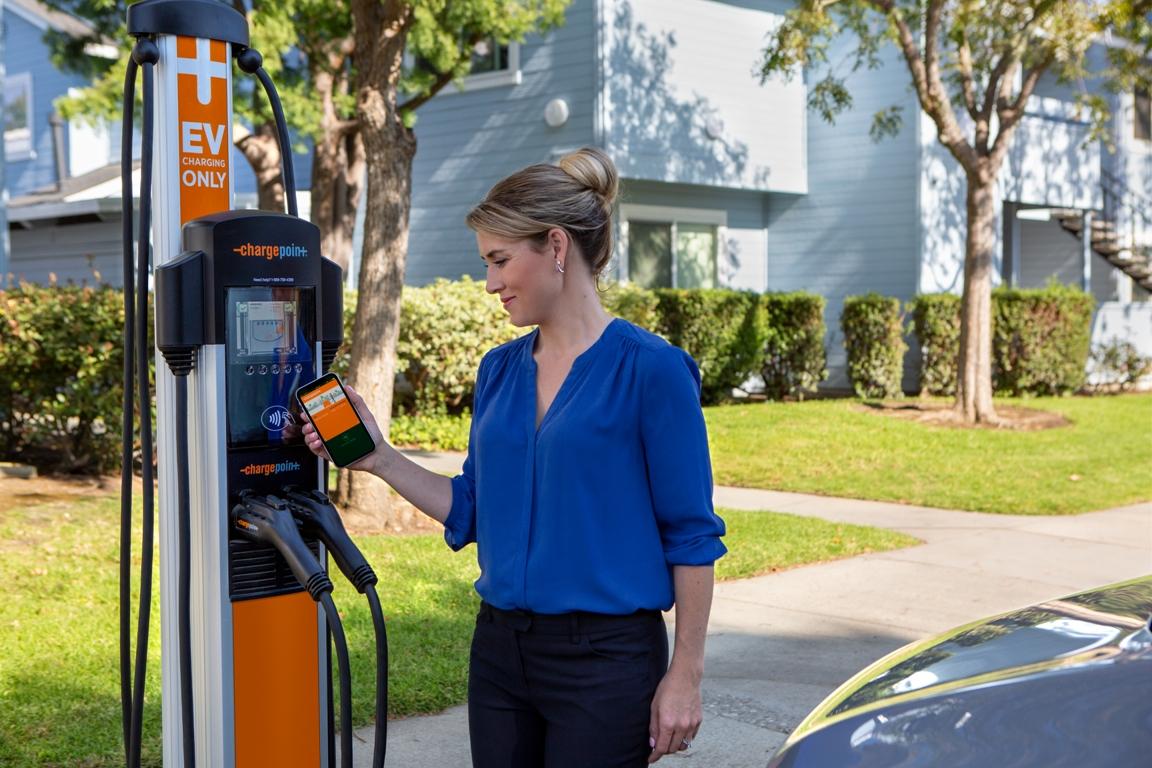 A person using a ChargePoint station