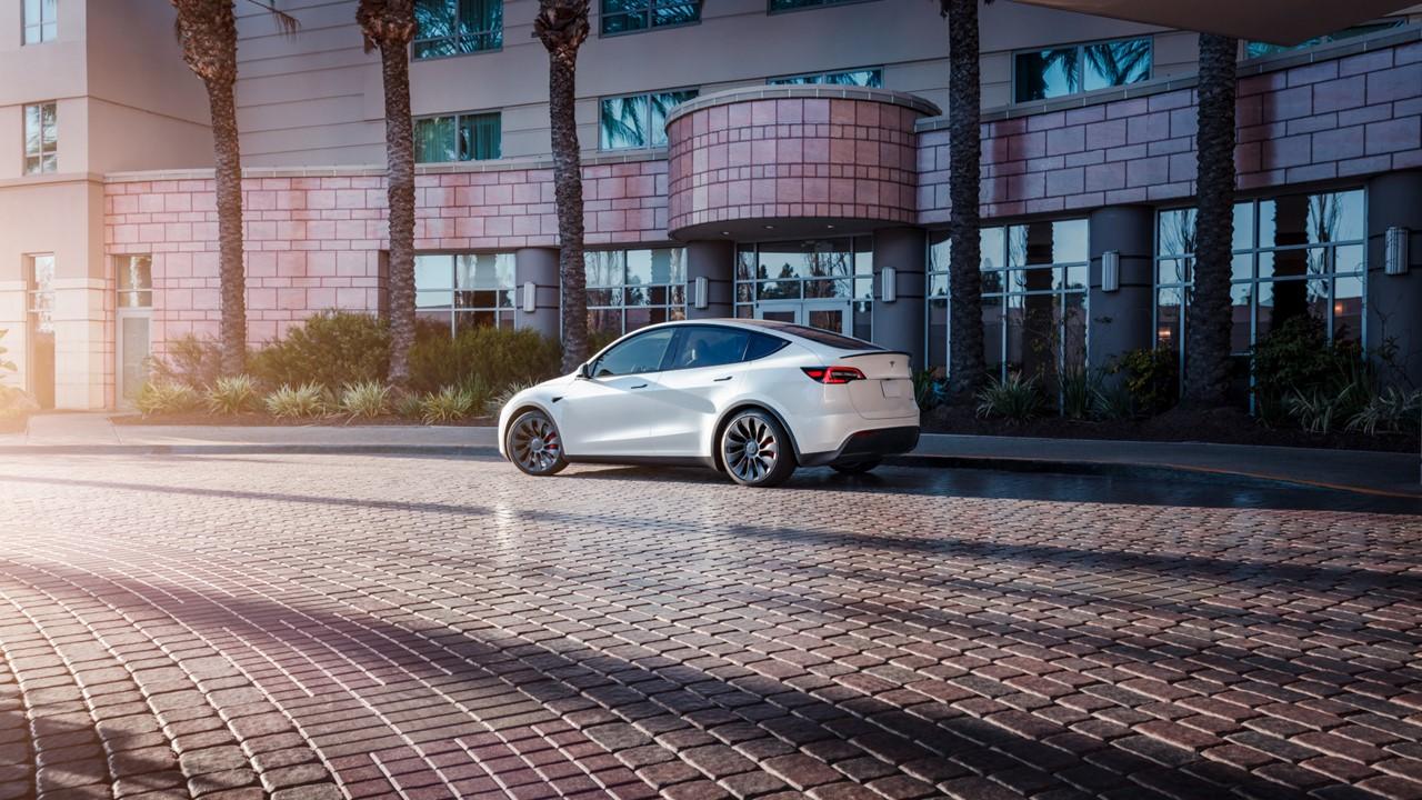 Tesla vehicle in front of building