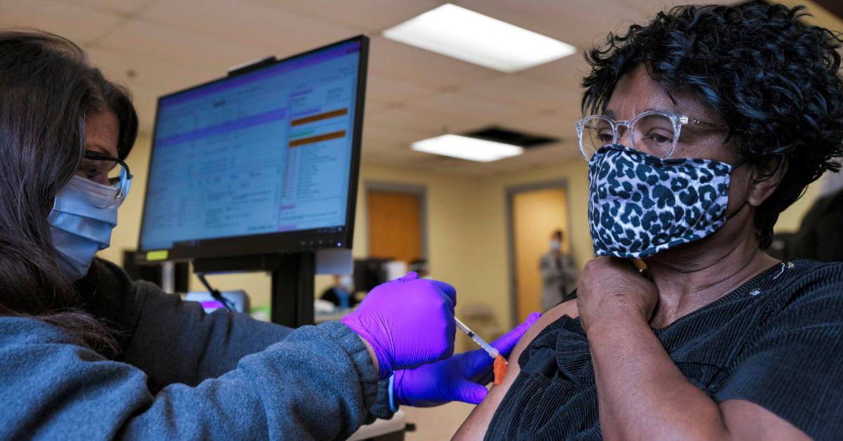 Person receiving COVID-19 vaccine