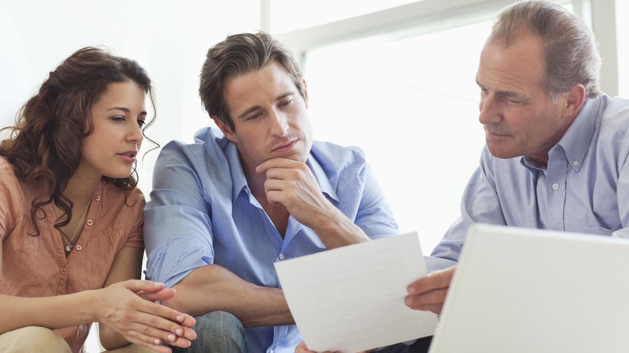 A couple talking to a financial advisor