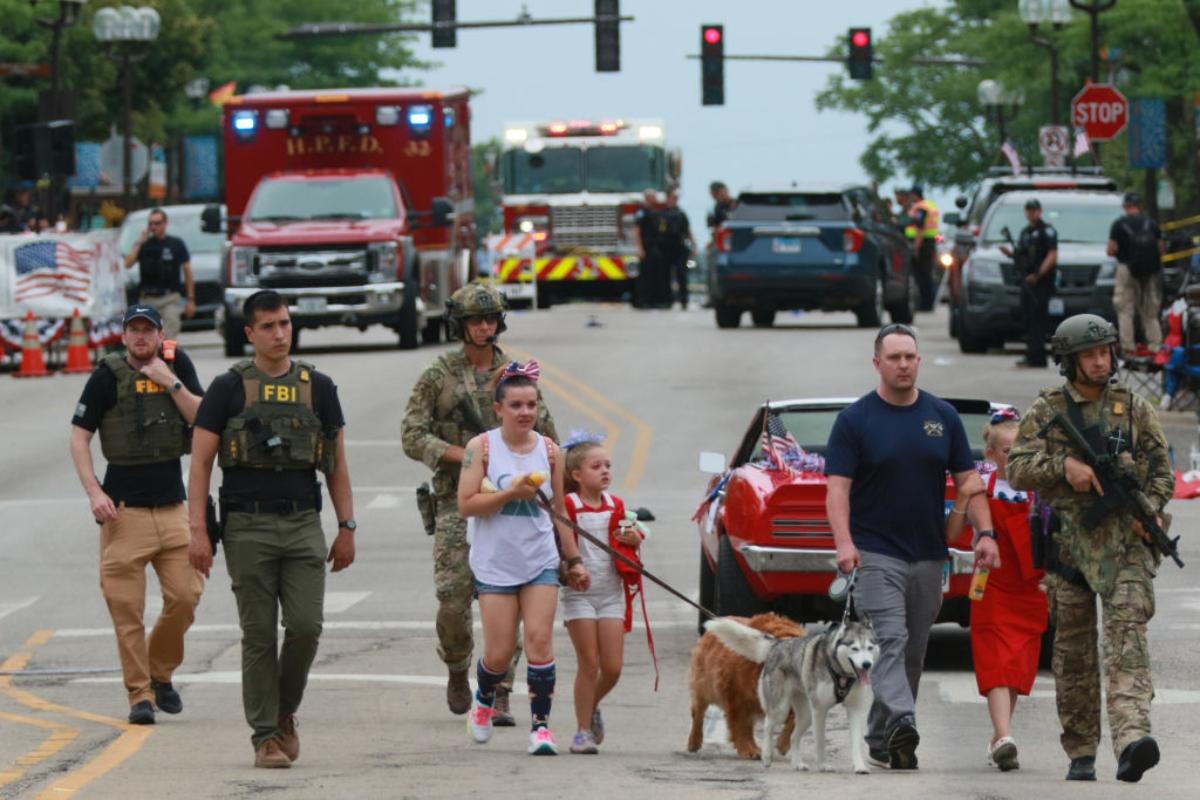 Officers helping people after a shooting