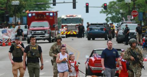 Officers helping people after a shooting