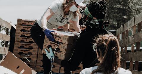 People unpacking goods at a charity event