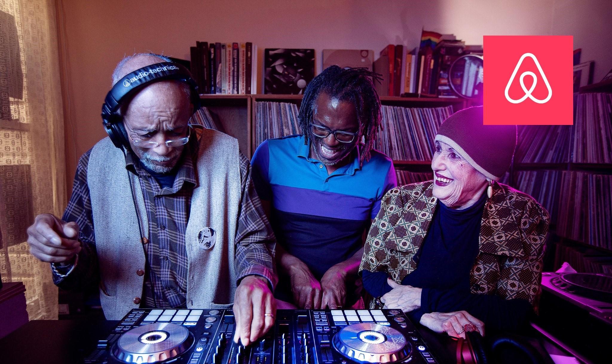 Airbnb logo over image of elderly people dj'ing at a party
