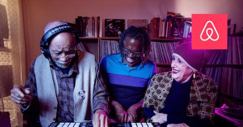 Airbnb logo over image of elderly people dj'ing at a party