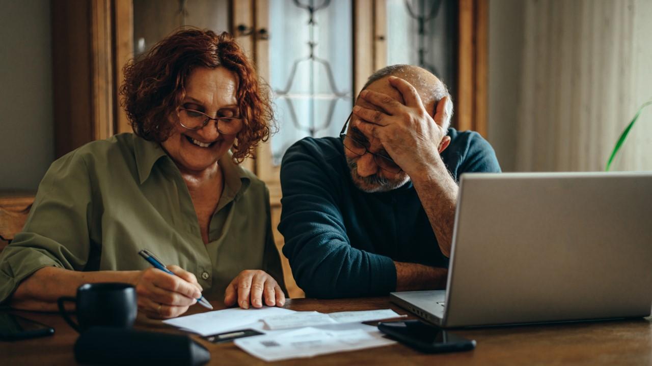 A couple looking at Social Security paperwork