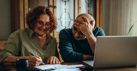 A couple looking at Social Security paperwork