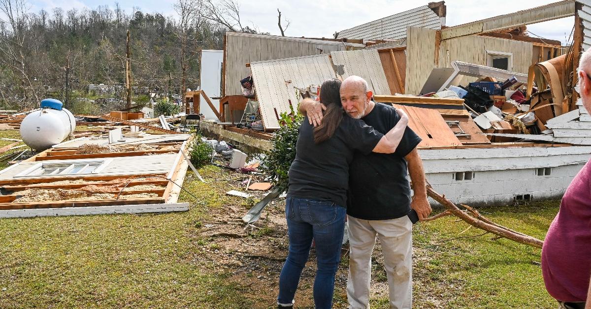 People looking at tornado damage