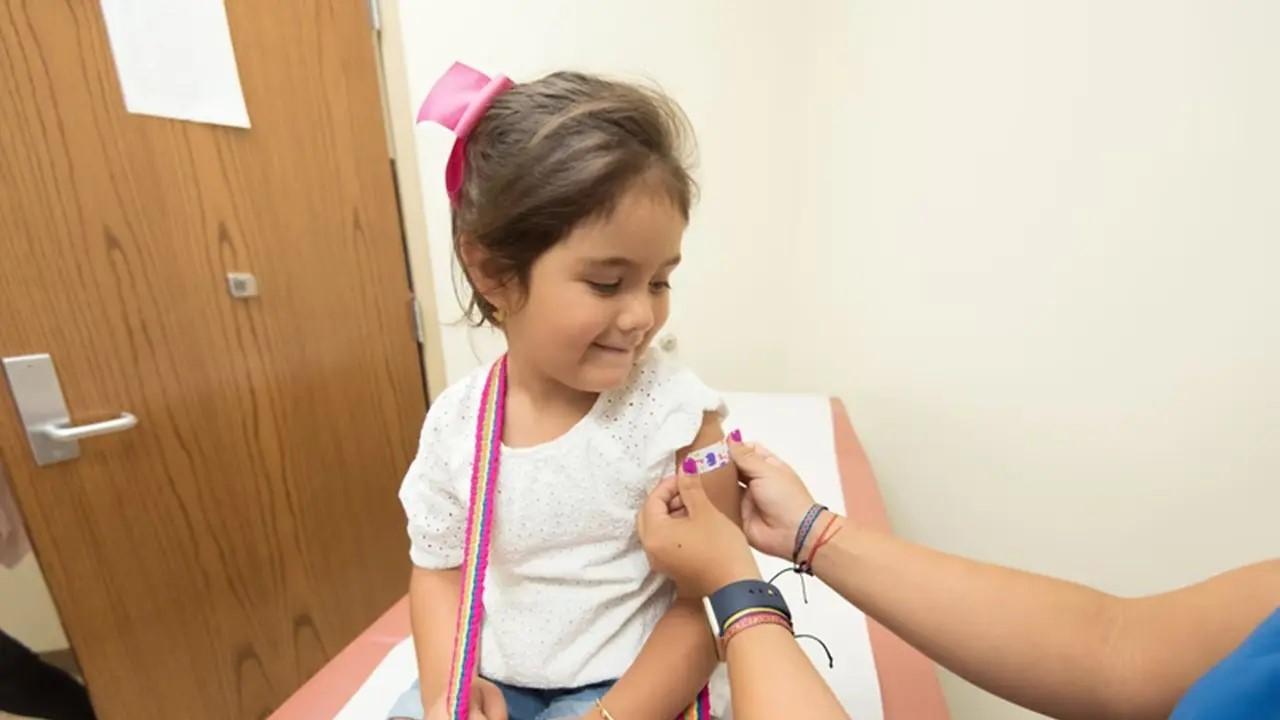 Young child getting vaccinated