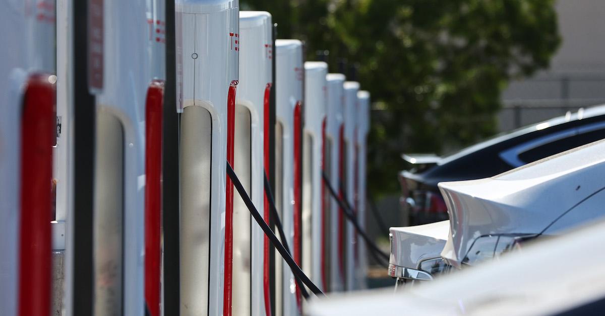 Tesla cars at a charging station